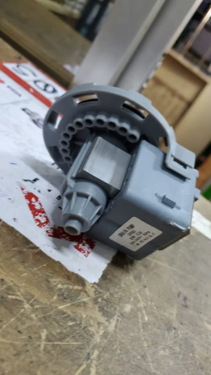 Close-up of a washing machine drain pump